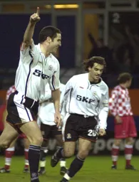 Chris Coyne wheels away in delight after scoring
