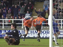 Dean Crowe runs away in delight after scoring