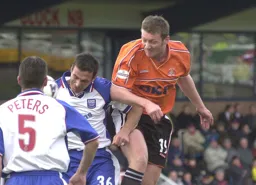 Steve Howard puts pressure on the Rushden defence