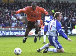 Adrian Forbes hurdles Andy Burgess