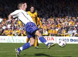 Dean Crowe nips in to net the Town's second goal