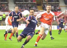 Ahmet Brkovic eyes the ball with Steve Howard watching on