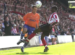 Ahmet Brkovic headers the ball