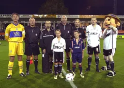 Kevin Nicholls with mascot vs Mansfield
