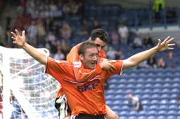Matthew Spring celebrates with Steve Howard