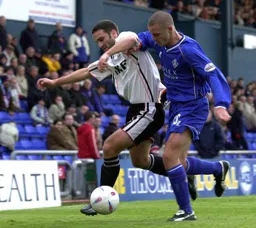 Andrew Fotiadis holds off the defender