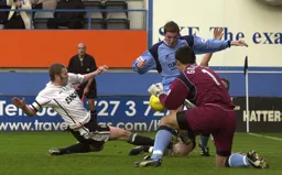 Kevin Nicholls challenging for the ball