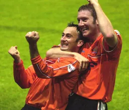 Ahmet Brkovic and Steve Howard celebrate a goal