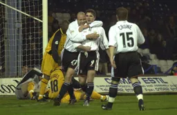 Paul Hughes and Dean Crowe celebrate Tony Thorpes goal