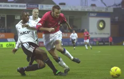 Kevin Nicholls watches Emmerson Boyce