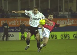 Andrew Fotiadis takes on the defender