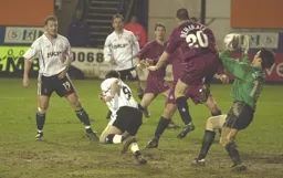 Steve Howard watches as the keeper gathers the ball