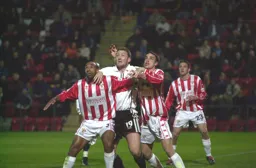 Steve Howard being heavily defended