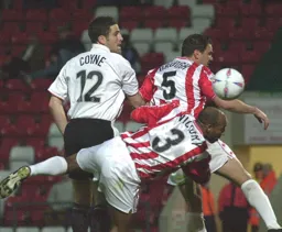 Chris Coyne giving the Cheltenham defender problems from a set piece