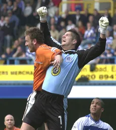 Steve Howard puts pressure on the keeper