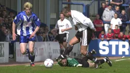 Carl Griffiths goes past the keeper