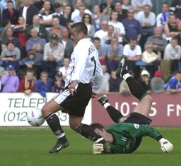Carl Griffiths rounds the keeper