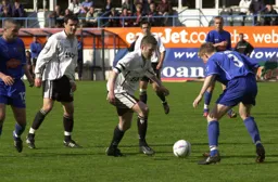 Kevin Nicholls about to go in for a tackle