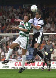 Chris Coyne heads one forward