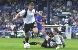Steve Howard goes around Nick Colgan to score Town`s second goal