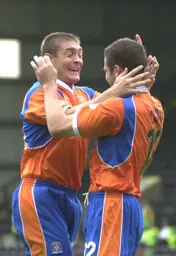 Chris Coyne has just scored Town`s goal and David Bayliss joins the celebrations