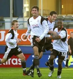 Smiles all around after Russell Perrett has headed in Town`s second goal
