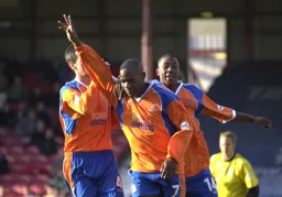 Adrian Forbes celebrates Town`s first goal. Courtney Pitt looks happy too
