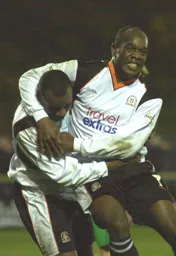 Goal scorer Emmerson Boyce and Adrian Forbes celebrate Town`s goal
