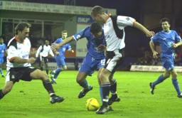 Sol Davis looks as though he is about to tackled by friend and foe