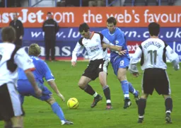 Matt Spring is held back by Tony Kay