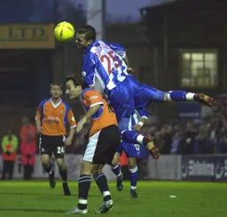 Sam Stockley climbs all over Ahmet Brkovic.
