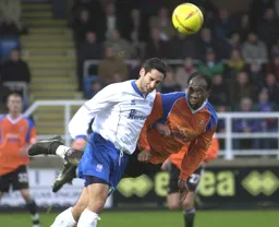 Adrian Forbes gets in front of Andy Sambrook to win a header