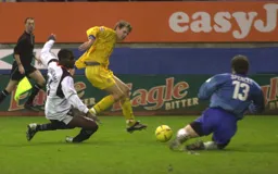 James Spencer blocks this run at goal by Enoch Showunmi