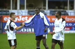 Happy Hatters Sol Davis Enoch Showunmi and Emmerson Boyce at the end of the game