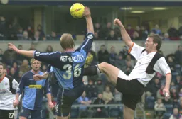 Feet and arms everywhere as Steve Howard and Stuart Nethercott go in for the ball