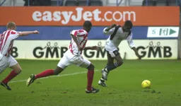 Enoch Showunmi is about to complete his hat-trick and score Town`s fourth goal