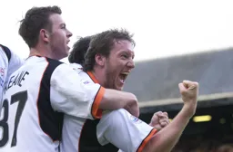 Steve Howard celebrates with Keith Keane after scoring Town`s first goal