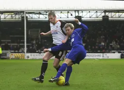 Kevin Nicholls looks to disposses Andy Legg