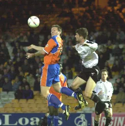 Steve Howard and future Hatter George Pilkington jump for the ball