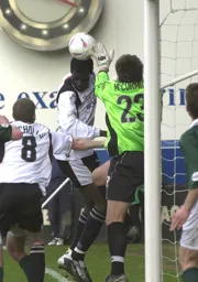 Luke McCormick comes under pressure from Enoch Showunmi