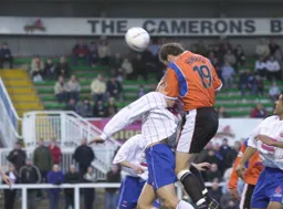 Steve Howard gets above Mark Tinkler to score Town`s first goal
