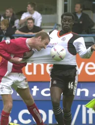 Enoch Showunmi clearly has his shirt pulled by Sean O`Hanlon