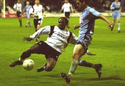 Adrian Forbes dives in for the ball