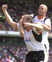 Steve Howard is congratulated after scoring the Town's first goal