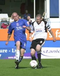 Kevin Nicholls about to chip the ball forward