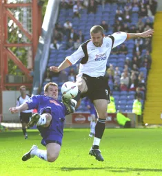 Rowan Vine gets the better of a Stockport defender