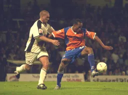 Calvin Andrew shields the ball from a Swans defender