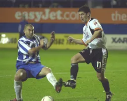 Steve Robinson wins this midfield battle