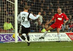 Rowan Vine fires in the first of his two goals