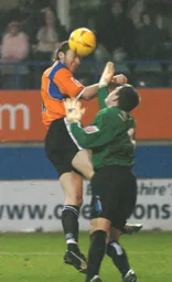 Steve Howard heads in